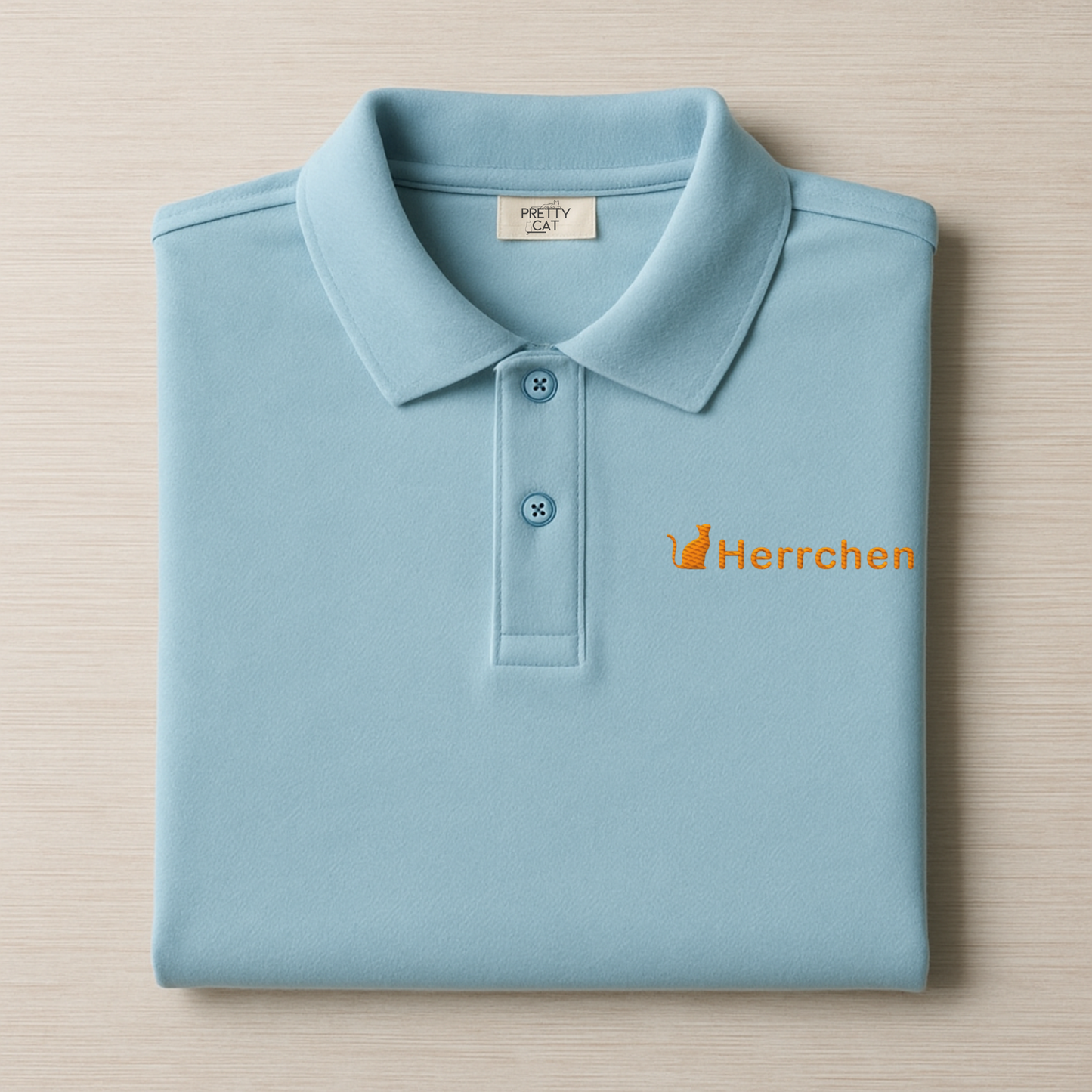 poloshirt in hellblau mit katze und dem spruch herrchen