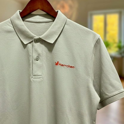 Poloshirt mit Katze und Statement Spruch "Herrchen" in Orange